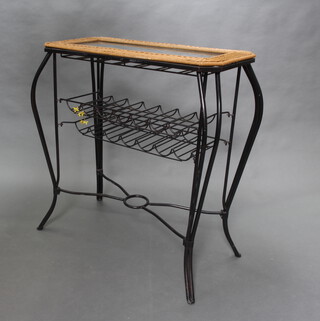 A tall iron and wicker rectangular table with glass top, the undertier incorporating a 14 bottle wine rack raised on cabriole supports with X framed stretcher 107cm h x 100cm w x 48cm w  