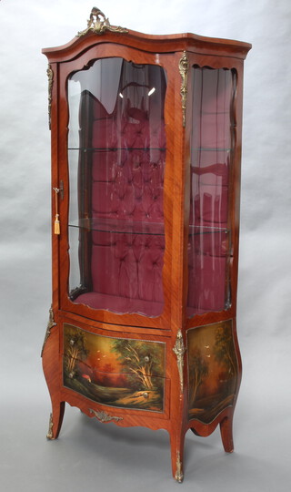 A reproduction Louis XV style vitrine cabinet of serpentine outline and gilt metal mounts, the interior fitted shelves, the base fitted 2 drawers, raised on cabriole supports 184cm h x 89cm w x 51cm d (crack to the side glass panel, both the interior glass shelves have chips, veneer missing to the edge) 