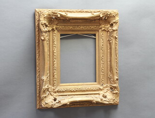 A large gilt plaster frame 79cm x 67cm (some damage to gilding) 