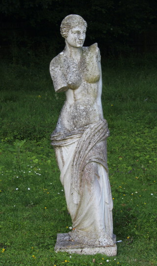 A well weathered reconstituted stone garden figure of Venus de Milo 130cm h x 33cm w x 33cm d 