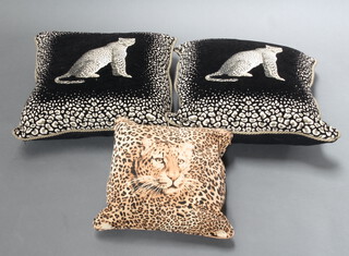 Two large black and white cushions decorated leopards 63cm x 62cm together with 3 other cushions (5)