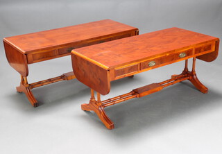 A pair of Georgian style miniature crossbanded yew sofa tables fitted a drawer, raised on turned supports with H framed stretcher 50cm h x 50cm w x 110cm when closed x 154cm when open (some water marks in places) 