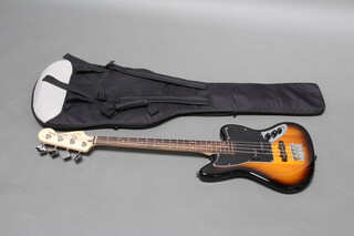 A Fender Jaguar Squier bass guitar in carry bag