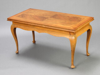 A 1950's quarter veneered and crossbanded rectangular walnut coffee table, raised on cabriole supports 52cm h x 98cm w x 49cm d (some light sun bleaching and water marks to top)
