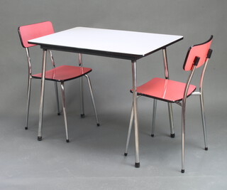 A 1950/60's retro chrome and formica kitchen table with grey formica top 74cm h x 90cm w x 61cm d together with a pair of chrome and pink formica chairs 
