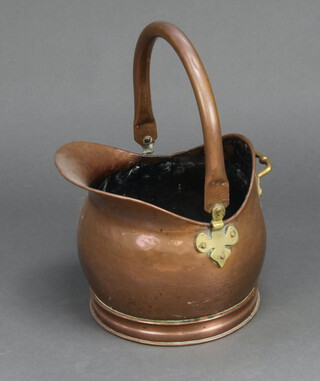 A copper and brass helmet shaped coal scuttle 36cm x 30cm x 27cm 