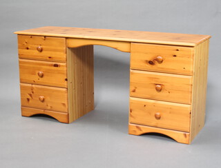 A pine pedestal desk/dressing table fitted 6 drawers with tore handles 69cm h x 141cm x 45cm d (some contact marks to the top)