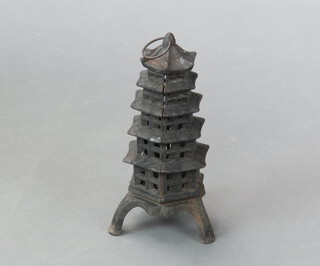 A Chinese style cast iron garden lantern in the form of a pagoda 30cm h x 20cm diam.