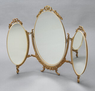 An oval triple plate dressing table mirror contained in a gilt frame with garland decoration (hinges f and r) 58cm x 77cm 
