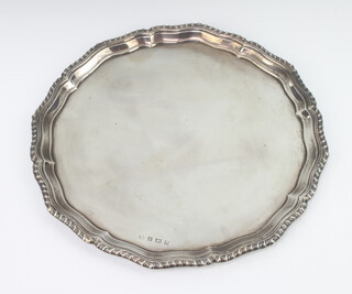 A silver salver with egg and dart rim Birmingham 1933, 26cm, 486 grams
