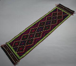 A green, blue and red ground Suzni Kilim runner with all-over diamond design 280cm x 76cm 