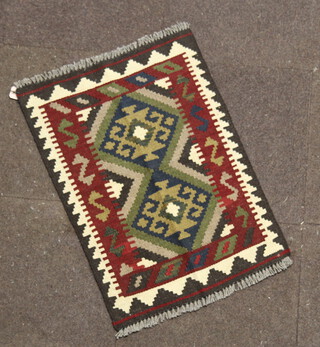 A brown and black ground Maimana Kilim rug with 2 stylised diamonds to the centre 180cm x 58cm 