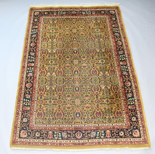 A machine made brown ground and floral patterned Persian style carpet 288cm h x 188cm  