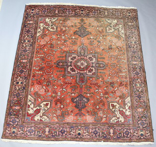 A red and blue ground Caucasian style carpet with central medallion in a multi row border 279cm x 249cm 