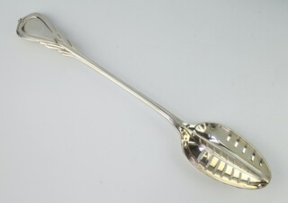 A Victorian lily pattern silver basting spoon with divider Sheffield 1898, 278 grams  