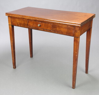 A Georgian rectangular mahogany tea table fitted a drawer, raised on square supports 74cm h x 91cm w x 43cm d 