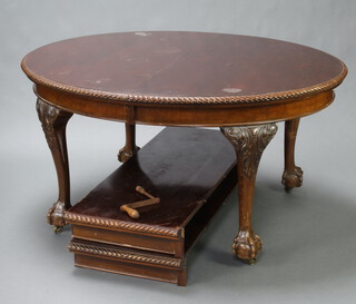 An Edwardian Chippendale style oval extending dining table raised on cabriole, ball and claw supports, complete with winder and 2 extra leaves, 76cm h x 120cm w x 145cm when closed x 240cm l when extended 
