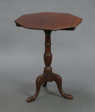 A 19th Century octagonal mahogany snap top wine table raised on a turned column and tripod base 69cm h x 53cm w x 55cm d 