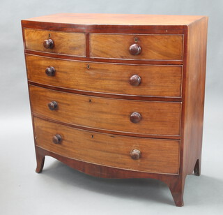 A Georgian mahogany bow front chest of 2 short and 3 long drawers with tore handles, raised on splayed bracket feet 106cm w x 105cm w x 52cm d 