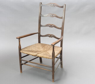 A 1930's beech framed ladder back carver chair with woven rush seat 89cm h x 52cm w x 40cm d (seat 29cm x 32cm) 