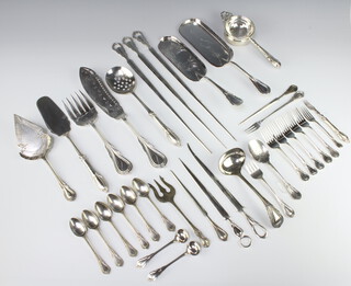 A pair of silver plated lily pattern fish servers, 3 crumb scoops, a quantity of meat skewers and flatware 