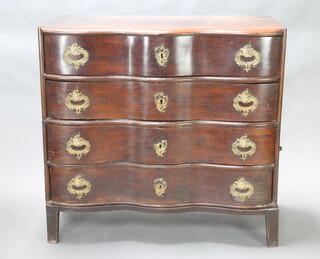 An 18th Century Dutch oak commode of serpentine outline, fitted 4 long drawers with brass carrying handles to the sides, raised on an associated base 110cm h x 117cm w x 61cm d 