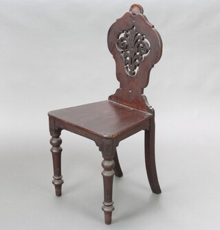 A 19th Century Continental mahogany hall chair with pierced slat back and solid seat raised on turned supports 92cm h x 42cm w x 35cm d (seat 30cm w x 28cm d) 