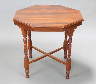 An Edwardian mahogany octagonal occasional table, raised on turned supports with X framed stretcher 68cm h x 75cm w x 73cm d  