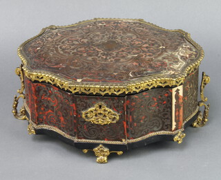 A 19th Century red boulle casket or serpentine outline with gilt metal mounts and plush interior, raised on scroll supports 15cm h x 31cm w x 25cm d 