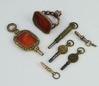 A 19th Century gilt hardstone seal and 5 pocket watch keys