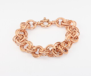 A 9ct rose gold triple link bracelet 10.7 grams