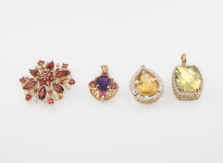 Four 9ct yellow gold gem set pendants, gross weight 18.7 grams 