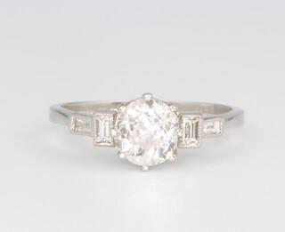 A platinum single stone diamond ring, approx 1.24ct with diamond shoulders 0.15ct, 4 grams, size N 1/2, with WGI certificate 