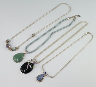 Four silver necklaces with hardstone mounts 