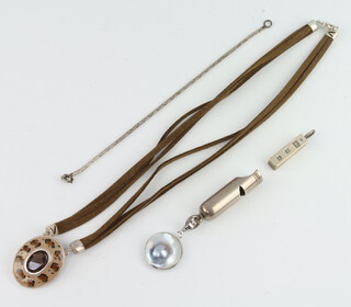 A silver whistle, ingot charm, bracelet and mounted pendant 