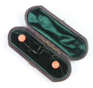 Two Victorian gilt metal mounted coral studs contained in a fitted box
