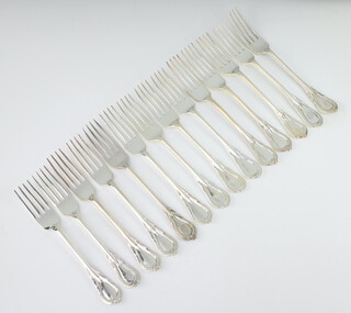 Fourteen silver plated lily pattern dessert forks 