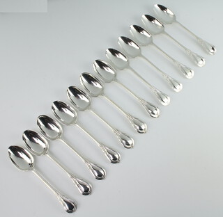 Twelve silver plated lily pattern teaspoons