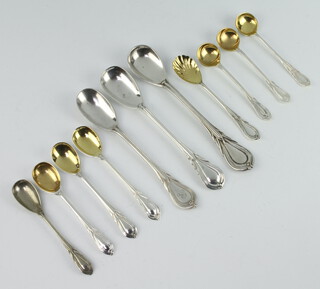 Eleven silver plated lily pattern mustard and salt spoons 