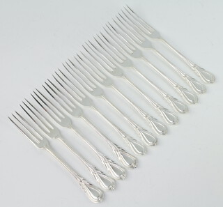 Twelve silver plated lily pattern 3 prong forks 