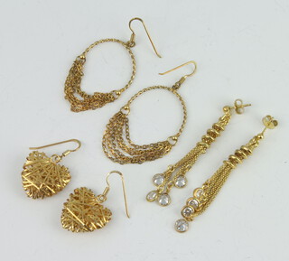 Three pairs of silver gilt earrings, 14 grams