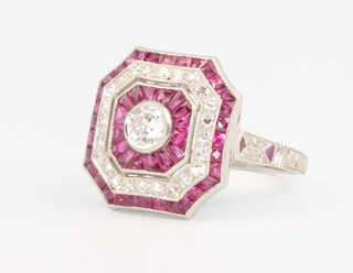 A Victorian style ruby and diamond octagonal dress ring, the brilliant cut diamond surrounded by baguette rubies and brilliant diamonds, diamonds approx. 0.56ct, rubies 1.25ct, size M, 7.1 grams