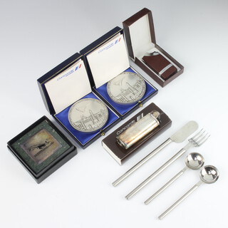 Concorde, two commemorative medallions for Air France Concorde flight to New York and Paris, 2 cigarette lighters, paperweight, knife, fork and 2 spoons