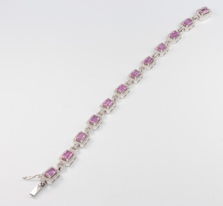 An 18ct white gold pink sapphire and diamond Art Deco style bracelet, the pink sapphires approx. 10.96ct, diamonds 2.44ct, 18cm, 20.6grams 