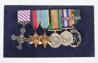 A Distinguished Flying Cross group of 6 medals, representing the achievements of Wing Commander L W Goodman, comprising George VI issue Distinguished Flying Cross decorated 1942, 1939-45 Star, Air Crew Europe Star, Defence medal, British War medal with mention in dispatch, George VI Territorial Decoration dated 1950 with 2 bars together with a letter of provenance from Princess Marine House Worthing. Goodman's original group (with the territorial efficiency medal) sold at Christie in May 2001