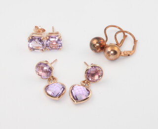 Two pairs of 9ct yellow gold and amethyst earrings together with 1 other pair, 2.7 grams gross, together with a pair of silver gilt ear clips 6.9 grams 
