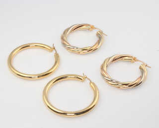 Two pairs of hollow 18ct yellow gold hoop earrings, 10.7 grams 