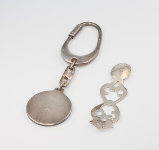 A 925 standard key fob together with a miniature pierced silver spoon decorated a Celtic knot 32.7 grams