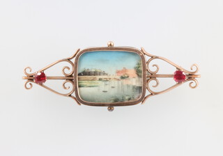 A yellow metal paste set bar brooch containing a painted ivory miniature of a riverscape, 70mm 