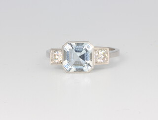 A platinum 3 stone aquamarine and diamond ring, the centre stone approx. 1.8ct, the brilliant cut diamonds approx. 0.40ct, size O, 4.7 grams 